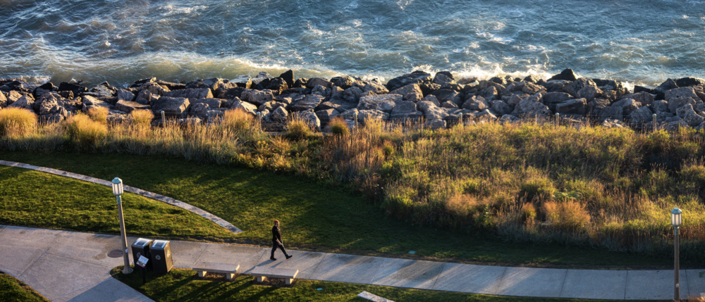 Student walking by the lake